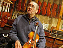 Clifford Roberts, a violin maker, had to retire from making violins because of a neromuscular atrophy disease. (Michael S. Wirtz / Inquirer). 